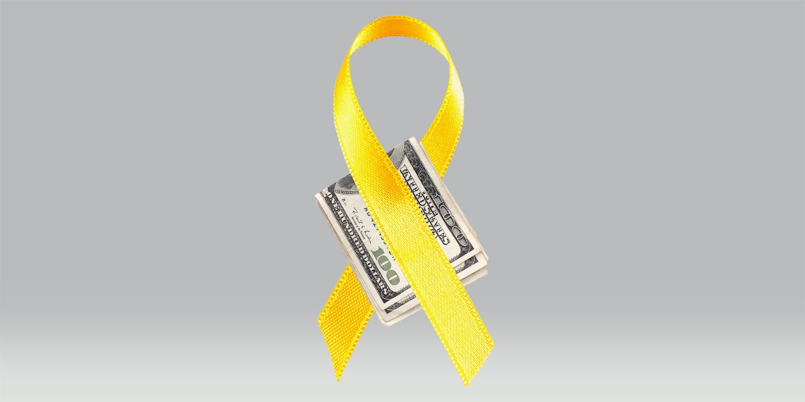 Folded dollar bills and a yellow ribbon.