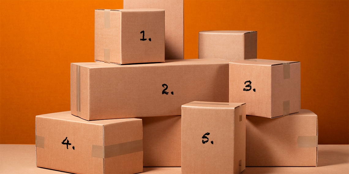 A stack of moving boxes with numbers 1 through 5