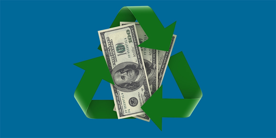 a recycling symbol around a stack of dollar bills