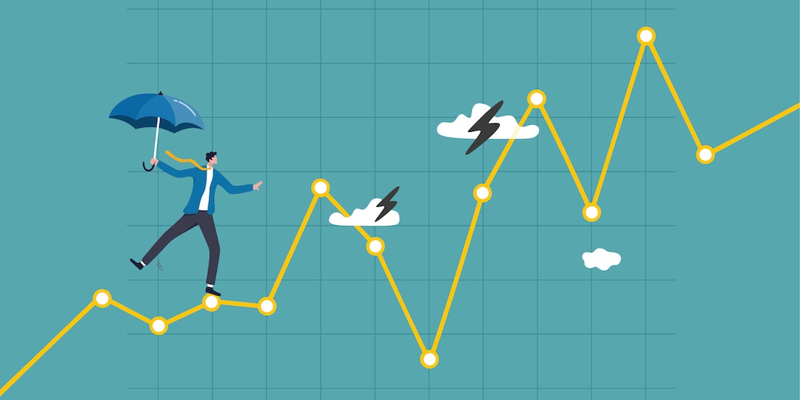 Person walking line graph of economic chart like high wire.