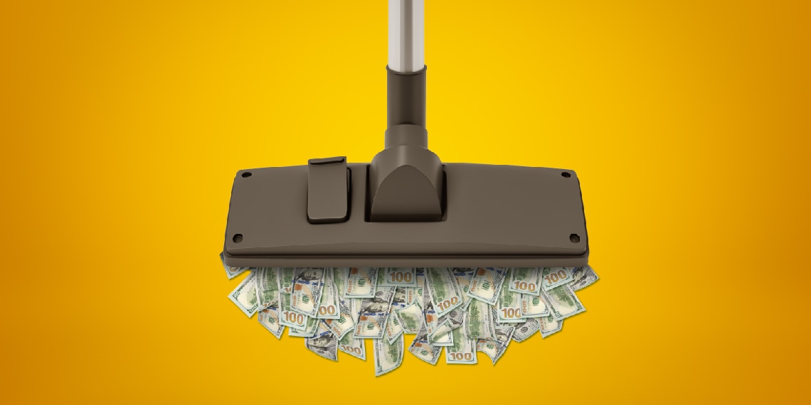 Image of mop pushing around dollar bills.