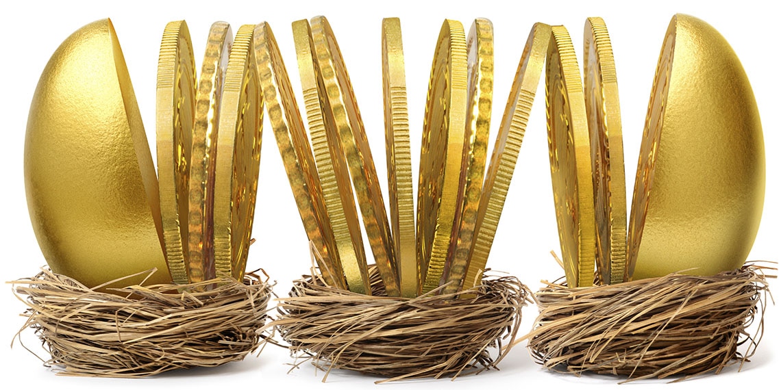 Golden eggs sliced into coins in three nests.