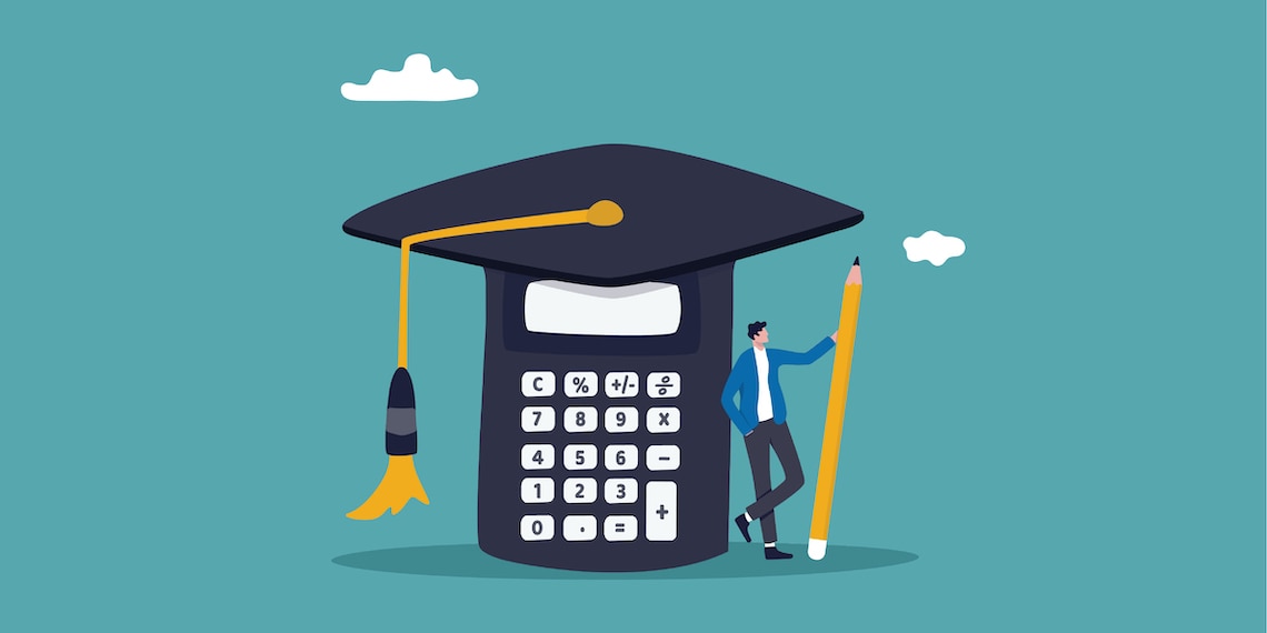 Man standing underneath calculator wearing a graduation cap.