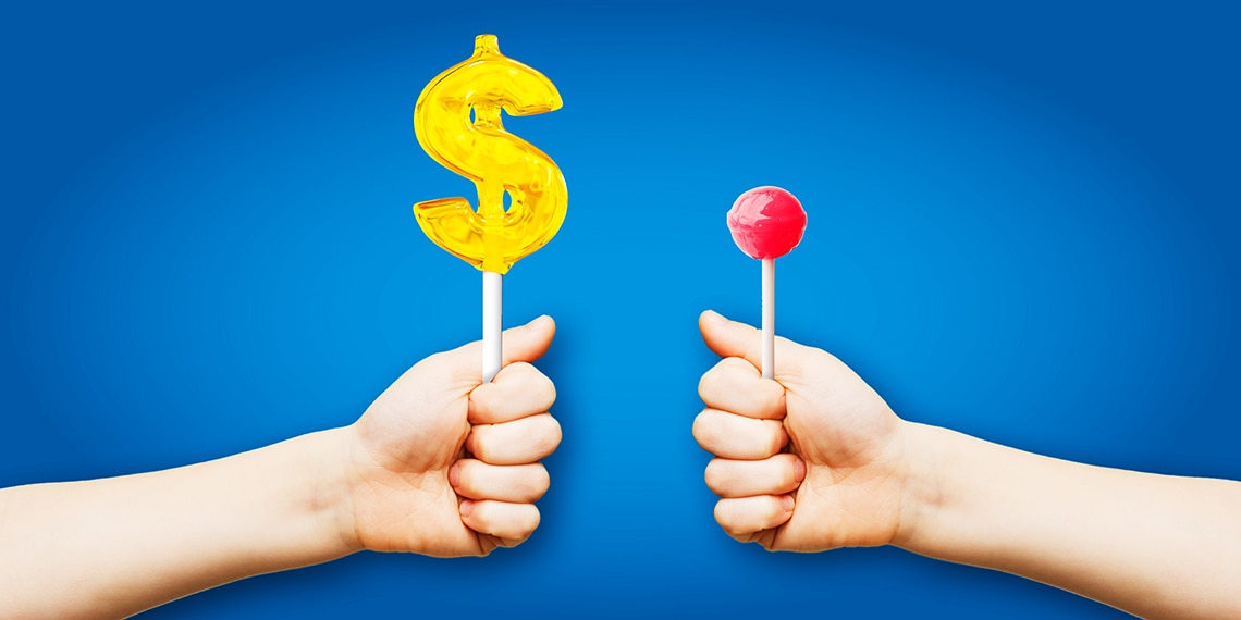 A lollipop with a large dollar sign and a smaller pink lollipop