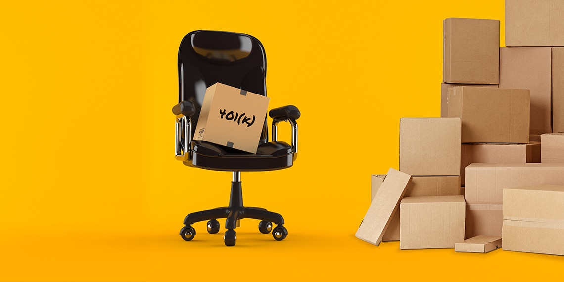 An office chair with moving boxes.